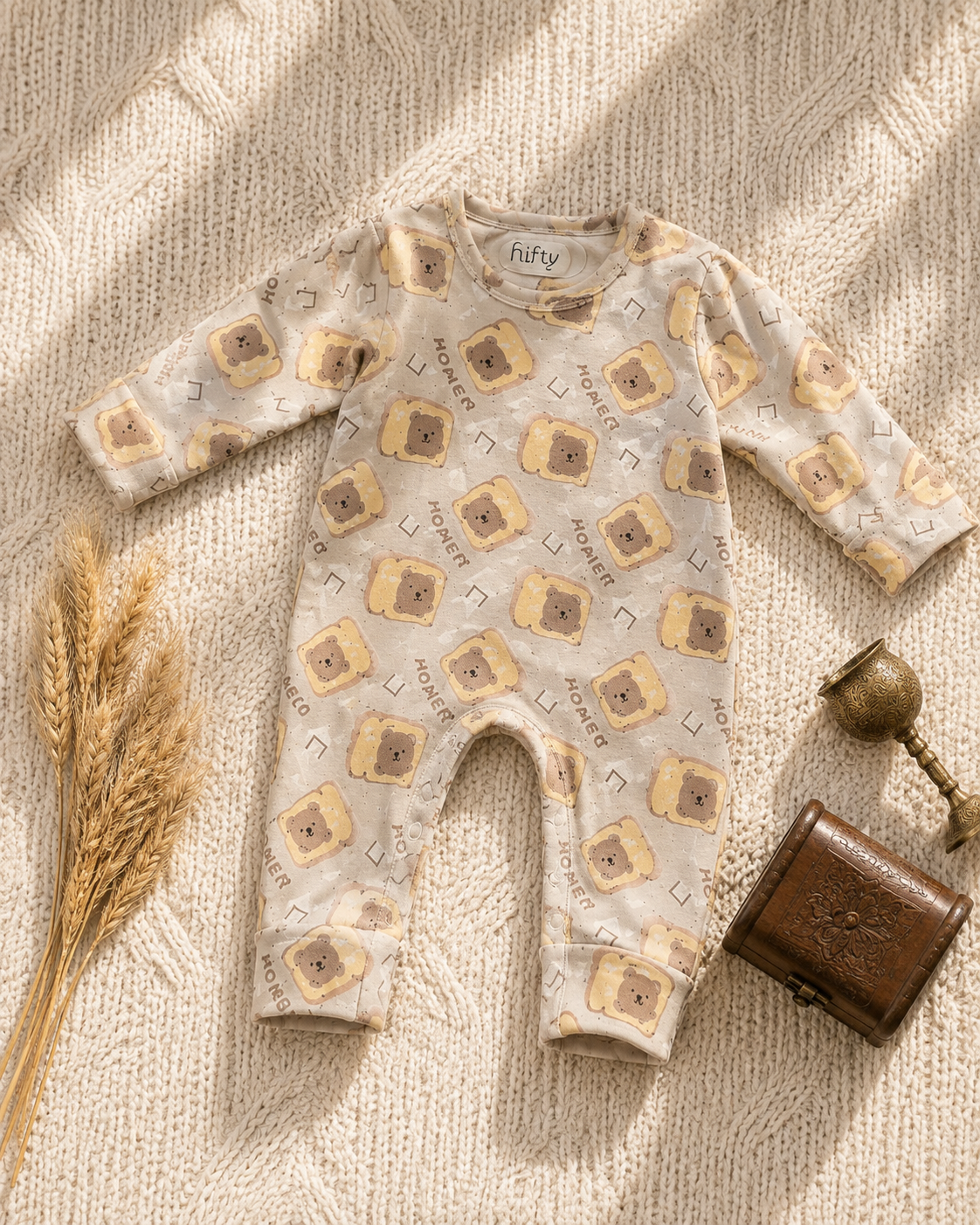 Cream baby romper with bear toast print