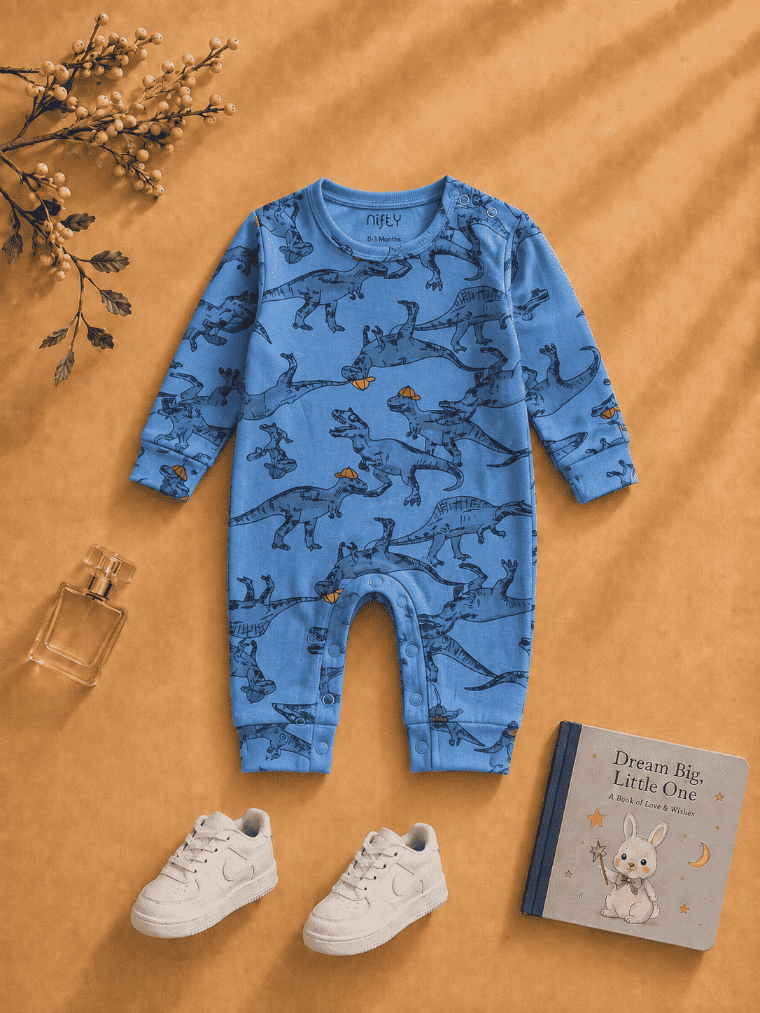 Blue baby romper with dinosaur print