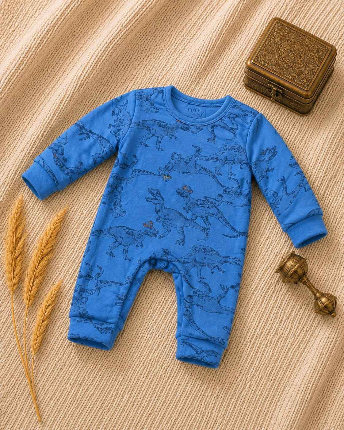 Blue baby romper with dinosaur print