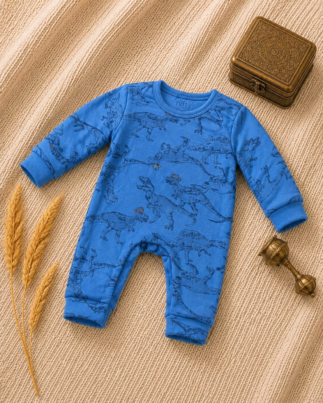 Blue baby romper with dinosaur print