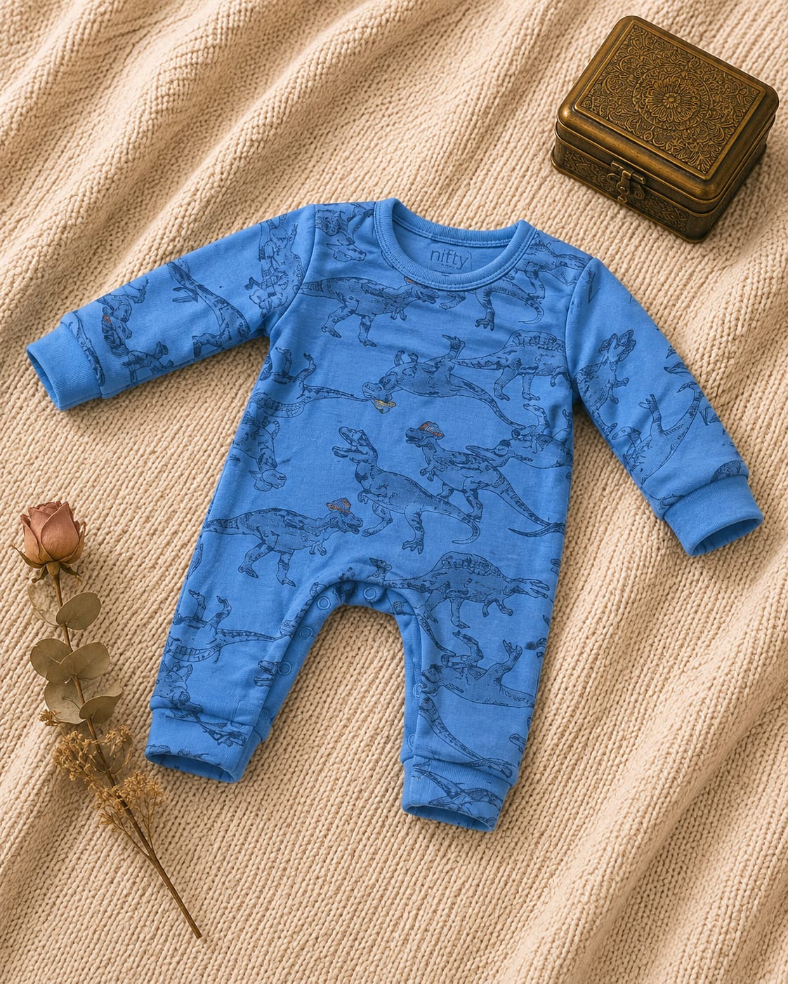 Blue baby romper with dinosaur print