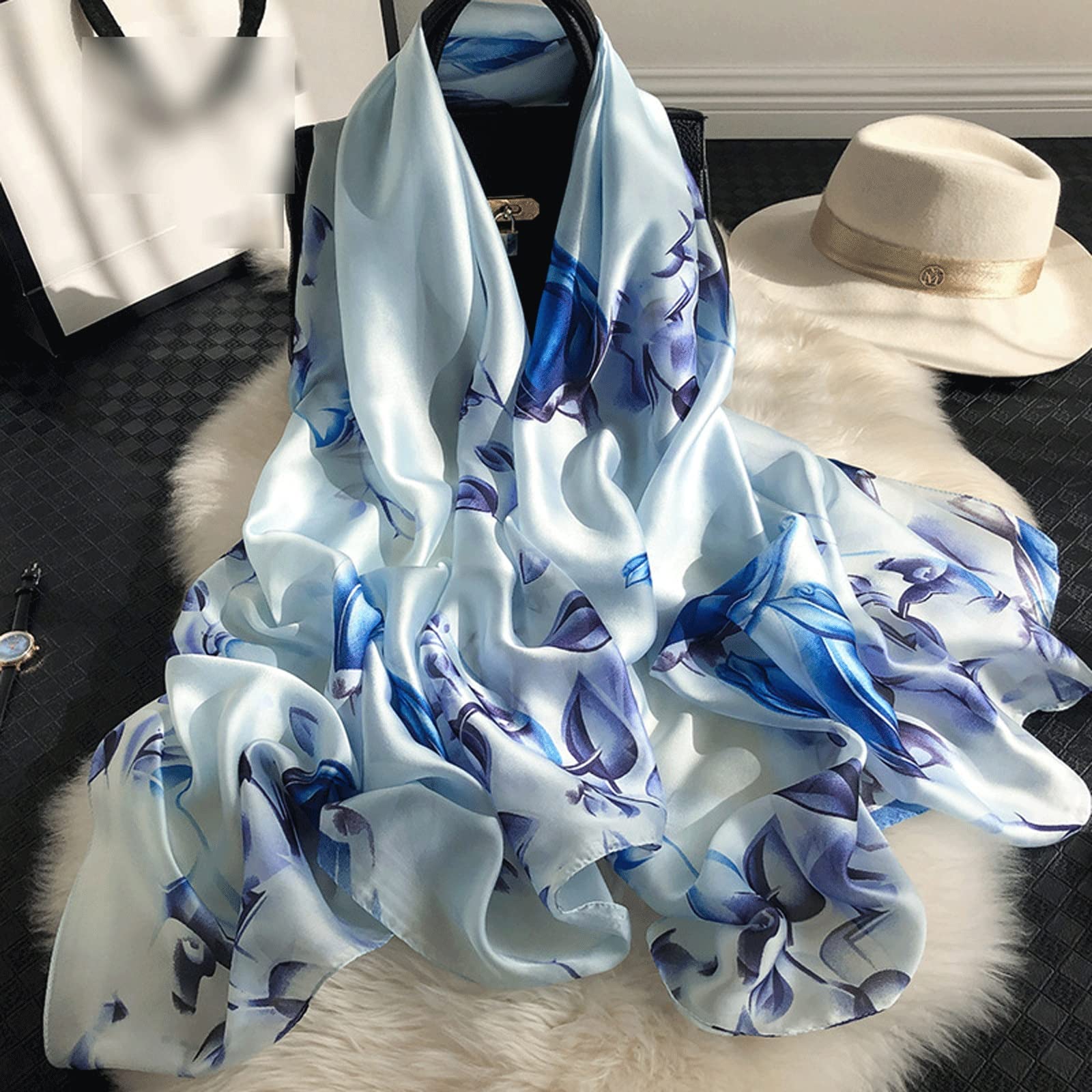 Ice blue silk-satin scarf with royal blue floral print and botanical leaf design