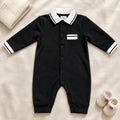 Black baby romper with white striped collar