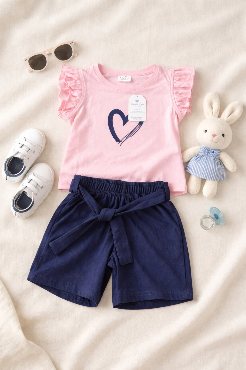 Girls pink shirt and shorts set with heart print in Pakistan by Basics by Nifty, soft breathable summer co-ord outfit for kids