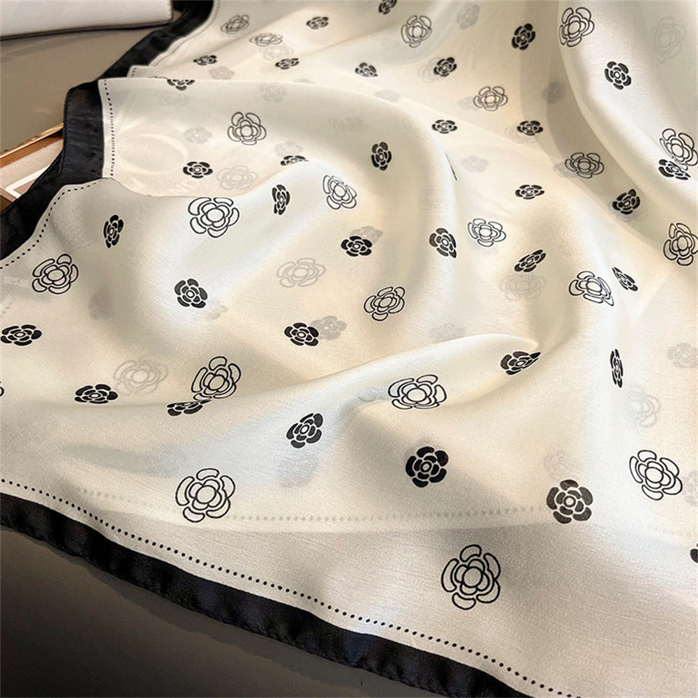 Ivory silk-satin scarf with black camellia flower line-art print and black bordered edge