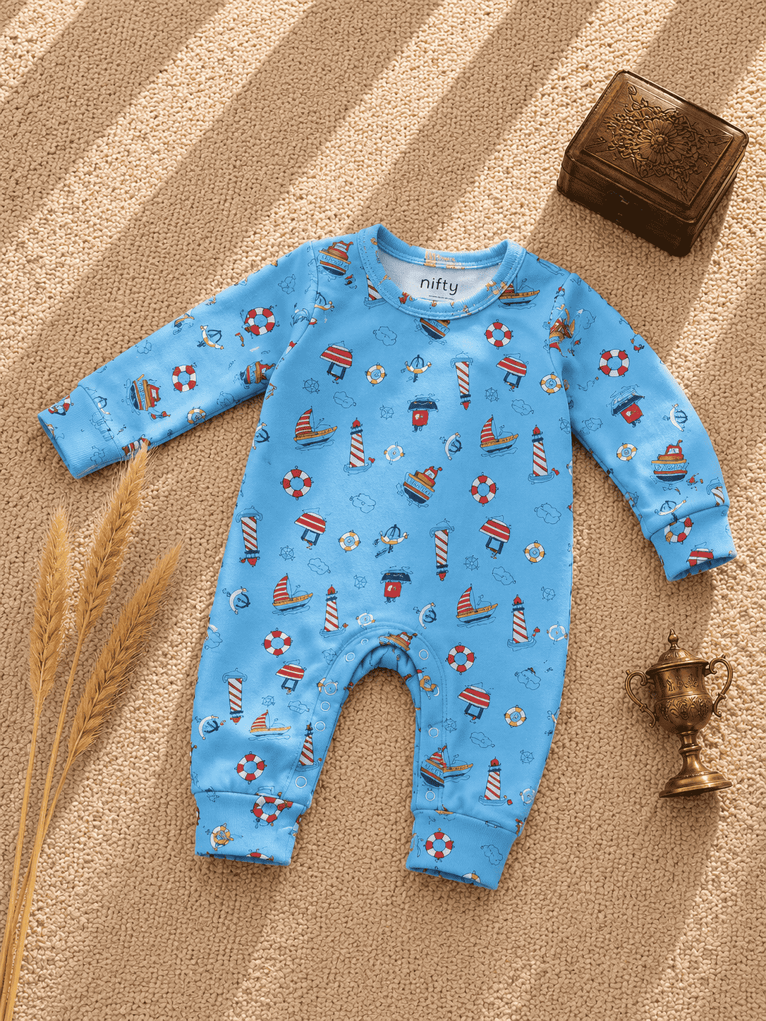 Blue baby romper with nautical boat print