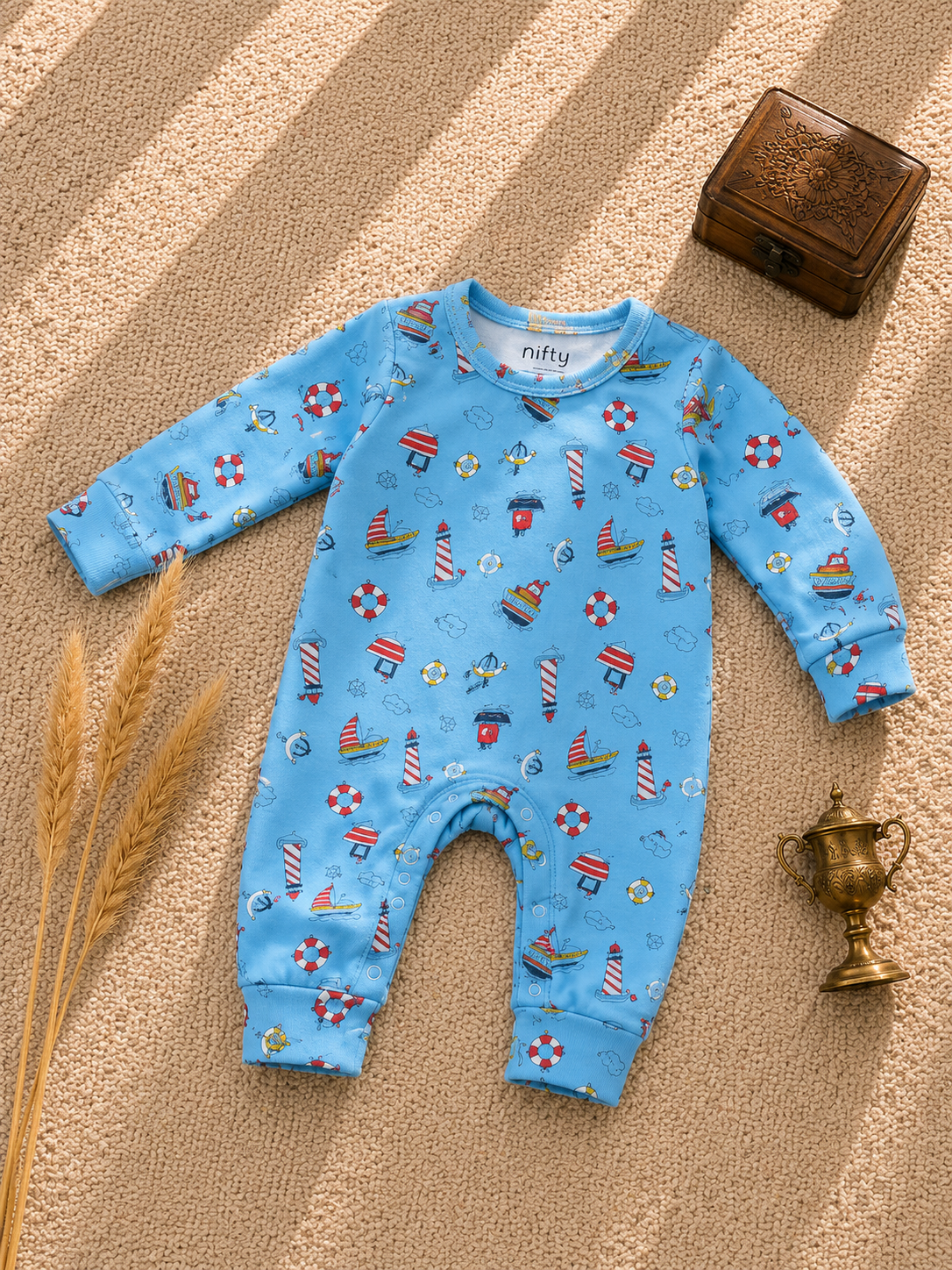 Blue baby romper with nautical boat print